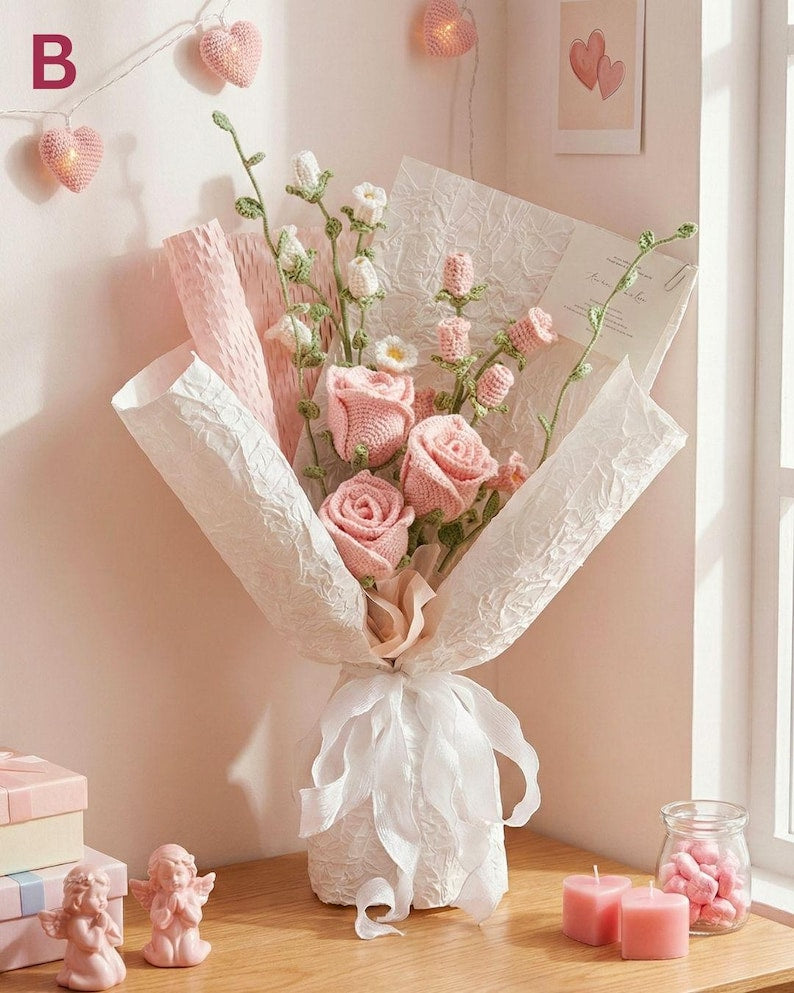Roze gehaakt rozenboeket: handgemaakte bloemen in zachtroze tinten