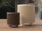 3D-geprinte plantenpot in mid-century stijl met poten en minimalistisch design