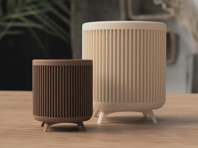 3D-geprinte plantenpot in mid-century stijl met poten en minimalistisch design
