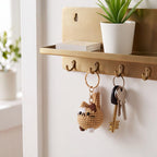 Gehaakte kattensleutelhanger met lapjeskatontwerp en opstaande staart