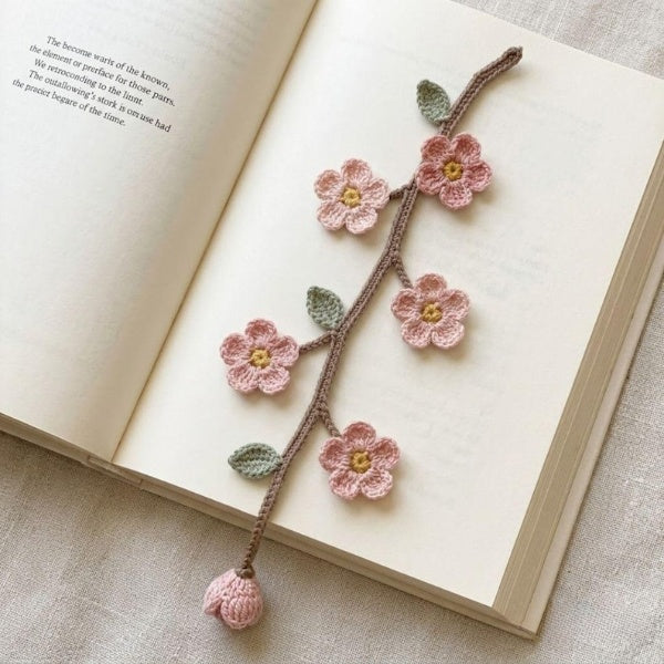 Gehaakte bloemenboekenlegger met zonnebloem- en madeliefjesmotief