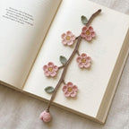 Gehaakte bloemenboekenlegger met zonnebloem- en madeliefjesmotief